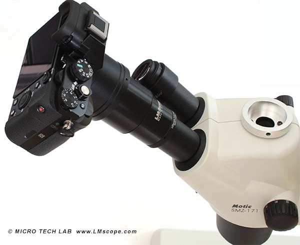 DSLM mirrorless system camera on eyepiece microcope tube