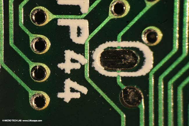 computer chip unter a childrens microscope