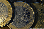 Euro coins with mysterious press cut